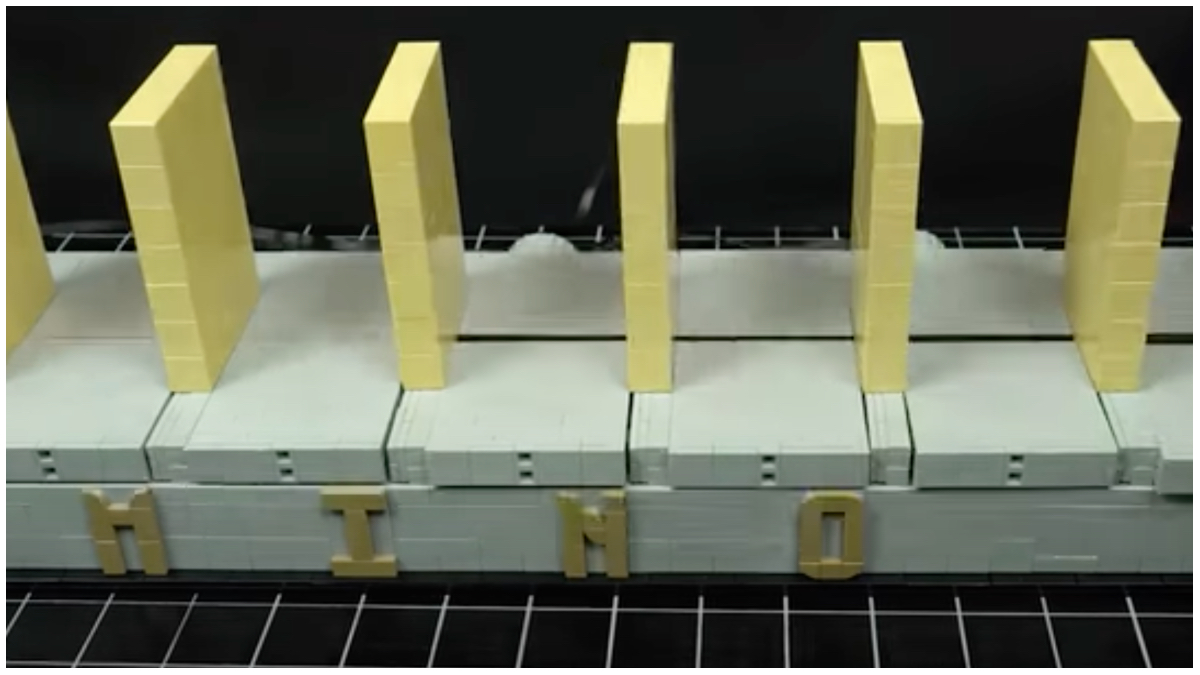 This perpetual LEGO domino toppling machine is hypnotic